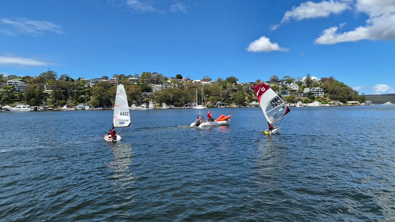 Two Bics out on Port Hacking beside the PHOSC support boat